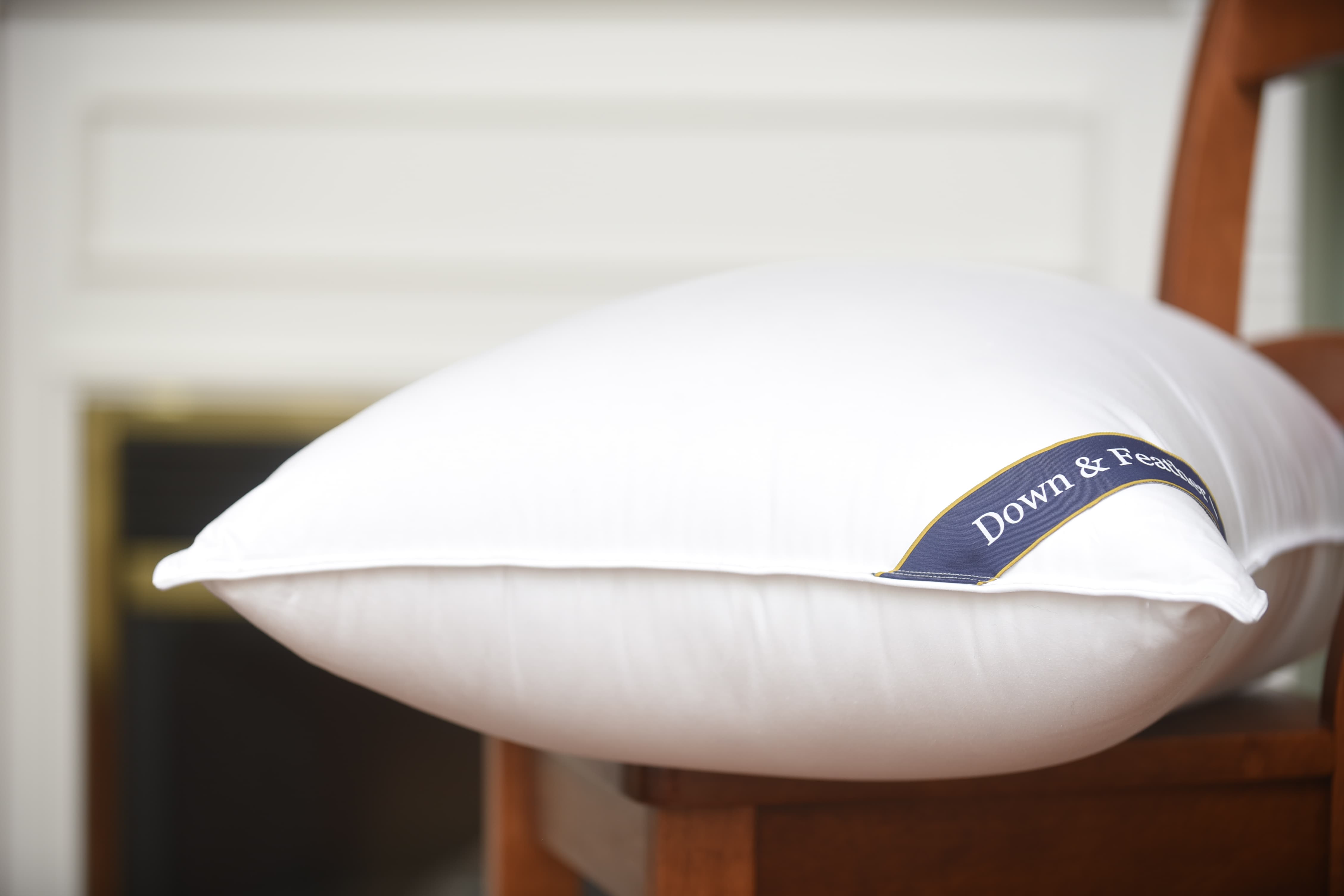 Quality Rest 650 Fill Power Goose Down Pillow side profile on chair